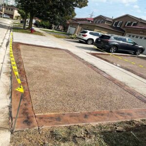 Exposed aggregate concrete with a decorative stone finish.