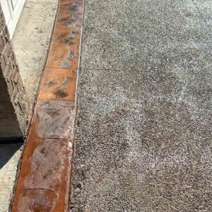 Decorative exposed aggregate concrete pool deck in GTA.