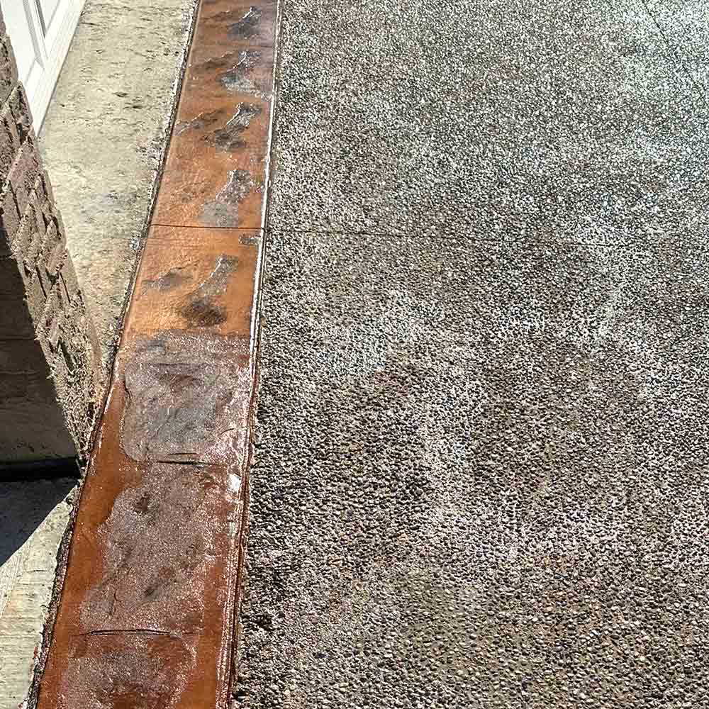 Decorative exposed aggregate concrete pool deck in GTA.