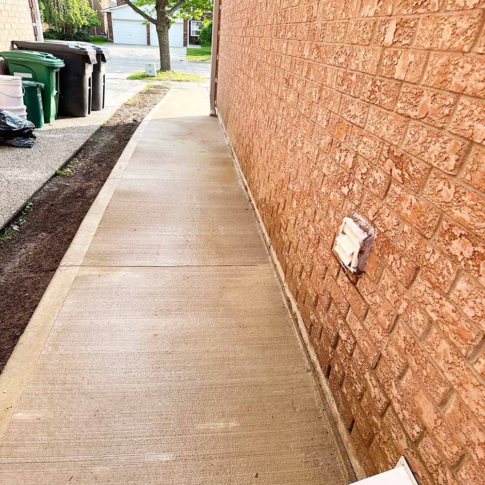 Professional plain concrete installation featuring custom color and a decorative border finish for a premium look.