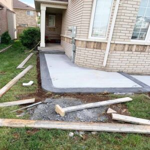 Professional plain concrete installation featuring custom color and a decorative border finish for a premium look.