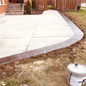 Professional plain concrete installation featuring custom color and a decorative border finish for a premium look.