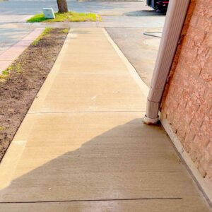 Professional plain concrete installation featuring custom color and a decorative border finish for a premium look.