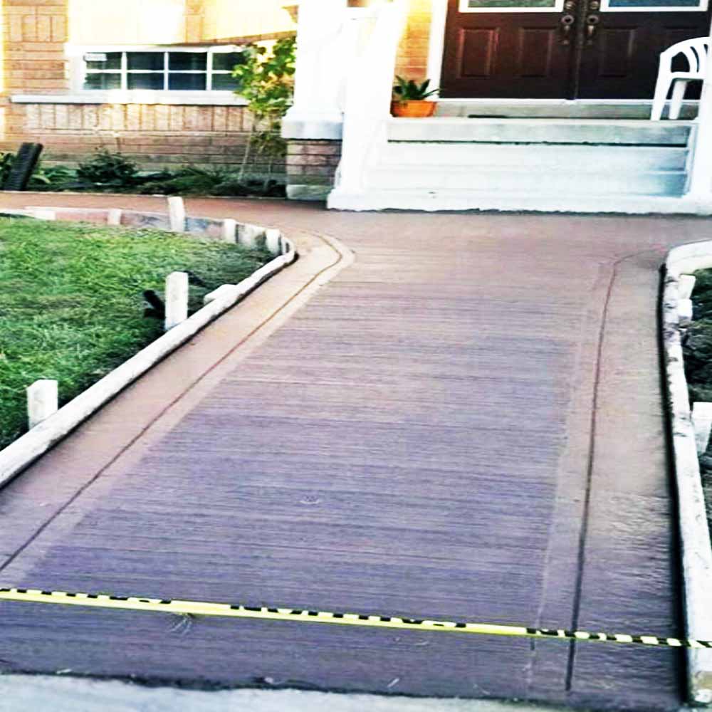 Professional plain concrete installation featuring custom color and a decorative border finish for a premium look.