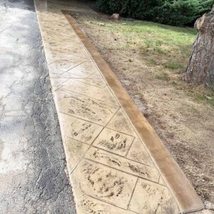 Professional stamped concrete patio with decorative border finish.