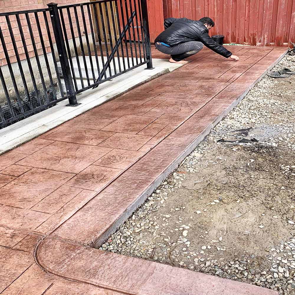 Custom stamped concrete patio installation without borders in GTA.