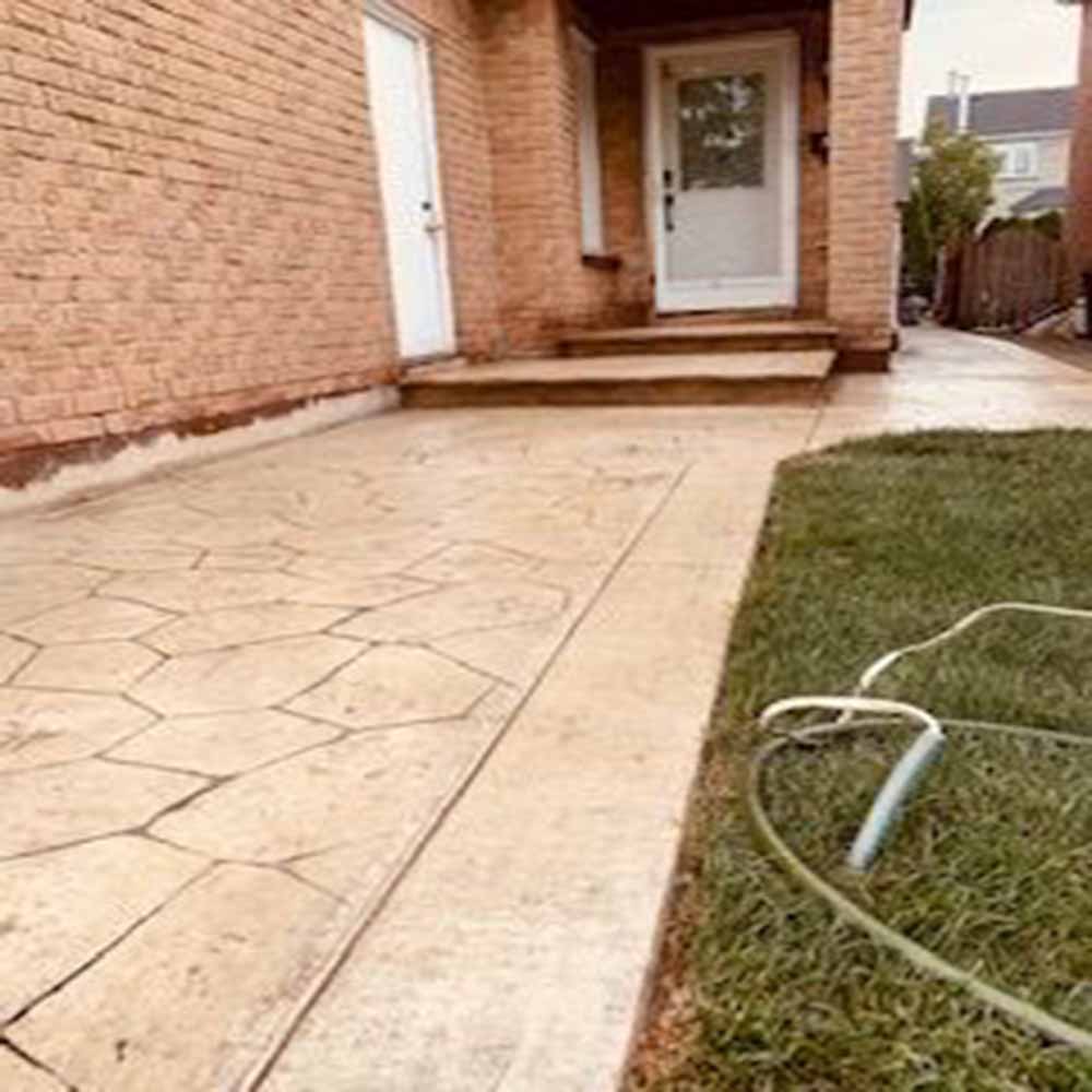 Wood-plank stamped concrete walkway installation.