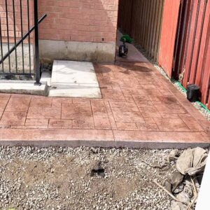 Textured stamped concrete walkway without border by Rhino The Renovators.