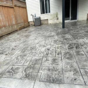 Wood plank texture stamped concrete terrace.