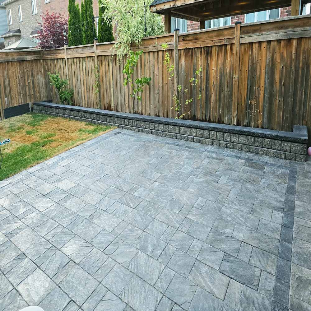 Modern patio design featuring gray interlocking stones.