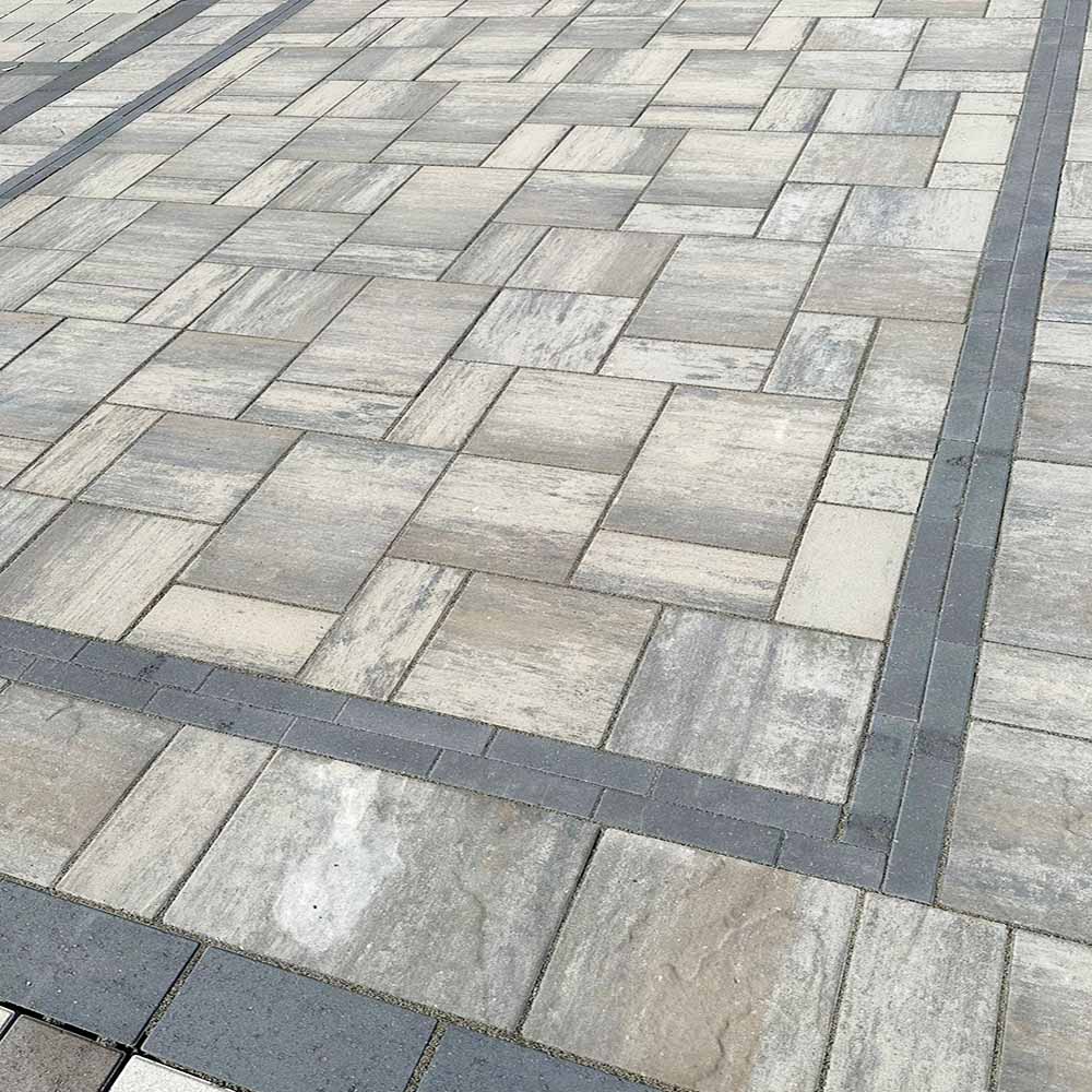 Close-up of interlocking stones with clean grout lines.