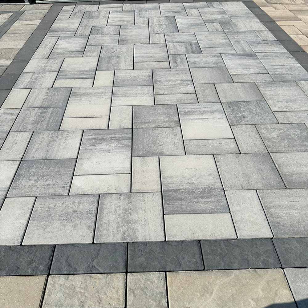 Close-up of interlocking stones with clean grout lines.