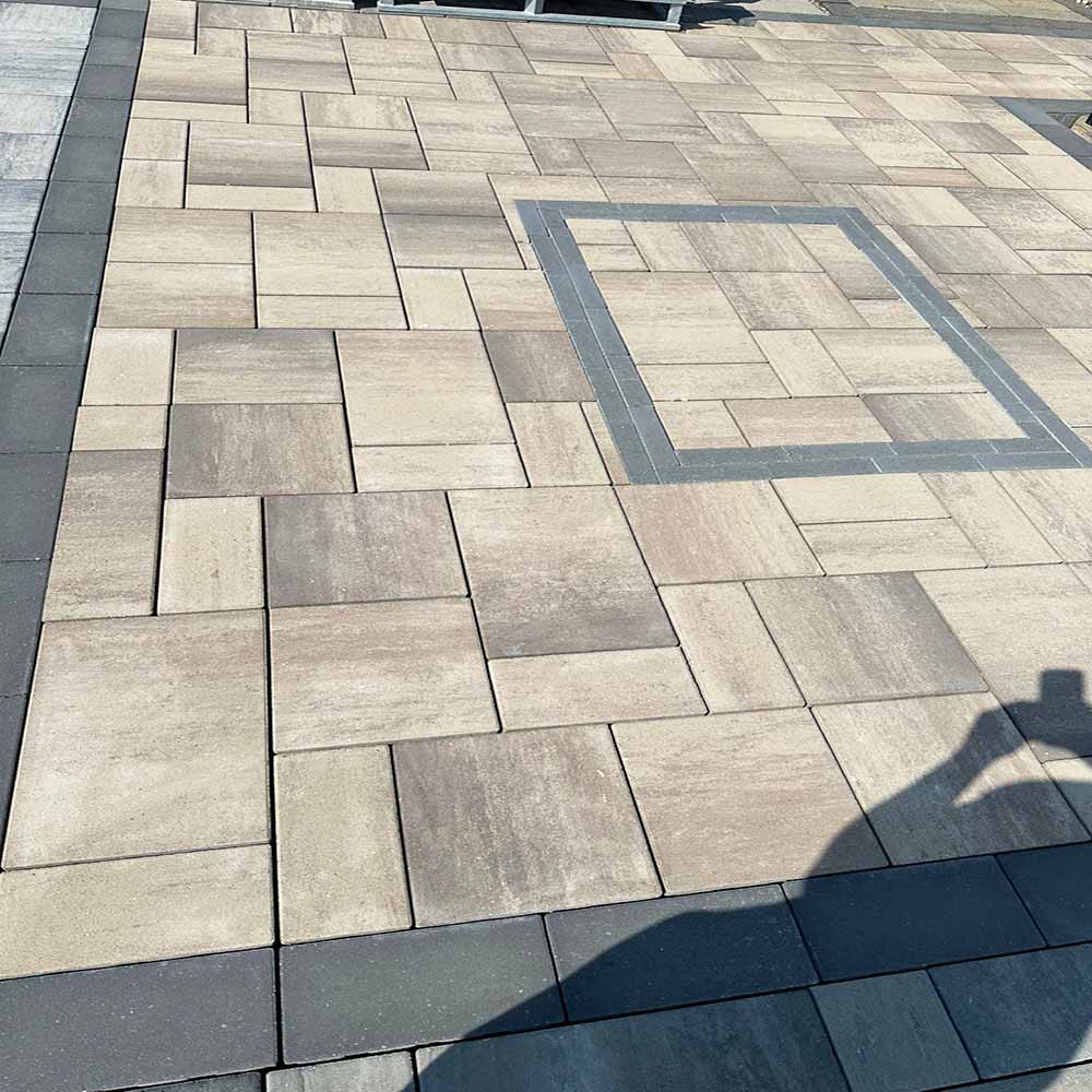Patterned stone interlocking with contrasting border stones.